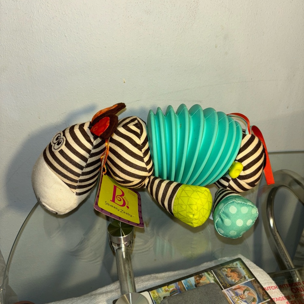 B. Toys Squeezy Zeeby Plush Toy Accordion makes melody,